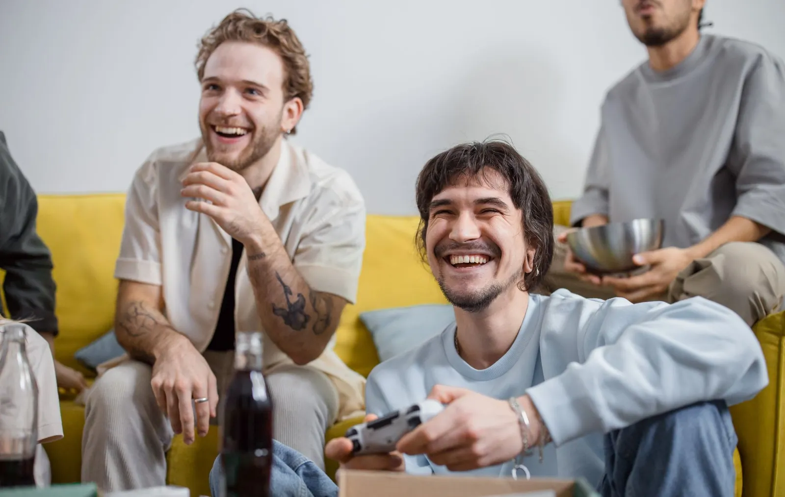 Men laughing together at a baby shower game