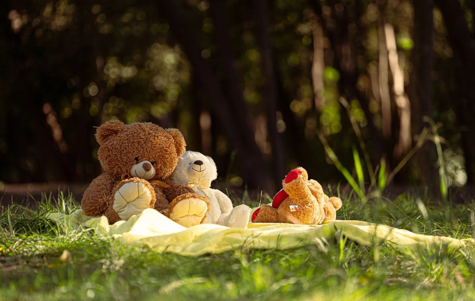 A jar of honey beside a teddy bear for a Winnie the Pooh baby shower